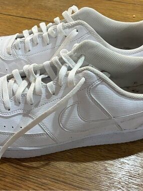 Nike All-White Low-Top Leather Sneaker Pair